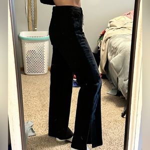 Black jeans with blue denim stripe down side